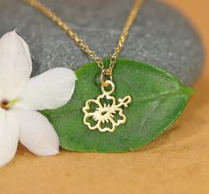 Hibiscus flower necklace - Hawaiian necklace - beach necklace - tropical necklace - tiny charm necklace This super cute gold vermeil hibiscus flower hangs happily from a 14k gold vermeil chain in the length of your choice. The are other fun charms available! Jellyfish - 8mmx12mm Cactus+Sun - 11mm Hibiscus - 9mm Cactus - 9mmx13mm Palm tree - 11mm Looking for other charm necklaces? https://www.etsy.com/shop/BubuRuby?section_id=12318467 More from Bubu Ruby? https://www.etsy.com/shop/BubuRuby?ref=si Gold Flower Jewelry For Beach, Gold Beach Jewelry With Flower Charm, Gold Jewelry With Flower Charm For Beach, Beach Flower Pendant Necklace, Dainty Flower Pendant Charm Necklace, Dainty Nickel Free Flower Pendant Charm Necklace, Dainty Nickel-free Flower Pendant Charm Necklace, Tropical Necklace, Hawaiian Necklace