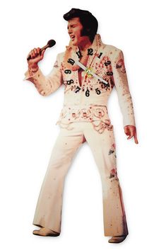 a man in white elvis presley outfit holding a microphone