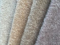 several different colors of fur are shown in this close up photo, including beiges and browns