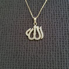 Brand New With Tags Bleu Sage "Allah" Pendant Necklace Excellent Condition With No Flaws 14k Gold Plating Over 925 Sterling Silver Chain Length Approx 16" With 2" Extender Pendant Drop Approx 7/8" Pendant Width Approx 11/16" "Allah" In Arabic Lined With Clear Crystals Hangs From A Gold Cable Chain Lobster Clasp Closure Please No Trades Or Lowballs! *Ask Any Questions You May Have Prior To Making An Offer Or Purchase Please* Allah In Arabic, Allah Pendant, Silver Link Necklace, Amber Bead Necklace, Tanzanite Necklace, Hematite Necklace, In Arabic, Lemon Quartz, Clear Crystals