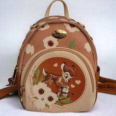 Disney Bambi & Thumper Watercolor Circle Portrait Convertible Backpack Is A Boxlunch Exclusive. Also Included With This Bag Is Limited Release Bambi & Faline Disney Enameled Trading Pin! The Pin Is Currently Affixed To The Strap Of The Bag ( As Shown In Pictures), So Please Note That If You Choose To Remove It, There Will Be A Hole In That Spot. Otherwise, This Bag & Pin Are In Mint Condition. Displayed Only, Never Used. Bag Measurements 8" W 10" H 4.5" D Bambi Backpack, Brown Disney Bags For Everyday Use, Disney Everyday Brown Bags, Disney Style Brown Bag For Everyday Use, Bambi Birthday, Brown Disney Backpack, Disney Style Brown Backpack For Disney Trips, Disney Brown Travel Bags, Disney Style Brown Travel Bag