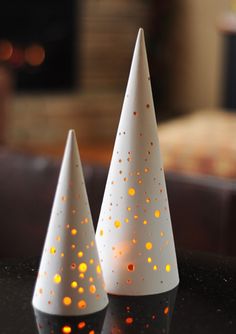 two white cones sitting on top of a table