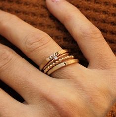 Mother's Day Gift | Personalized stackable ring set, engraved with a cross and the word 'faith'.  Metal: 14k gold filled or .999 fine silver Dimensions: engraved rings are 2mm tall on average, but our rings are handmade so variations will occur. Beaded ring is 2mm, and birthstone is 2mm on a 1mm band. Font: lowercase cursive Unsure what size you need? We highly recommend using our ring sizer for an accurate fit. Some people find that sizing up when stacking 3 or more rings is more comfortable. h Personalized Stackable Rings, Stackable Ring Sets, Stacking Ring Set, Cross Ring, Gold Filled Ring, Ring Sizer, Ring Set, Beaded Rings, Gold Filled Jewelry