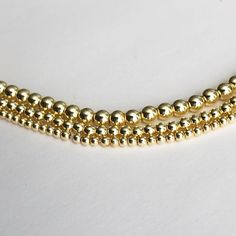 "One of our best Sellers Dainty 14K gold filled beaded ball necklace - dainty and minimalist in design, making it perfect for layering. Comes with 3\" extension option, you can wear it as choker or necklace, whichever style suits for the occasion! Our best sellers! Dainty and beautiful gold filled beaded necklace. With 3\" extension option, you can wear it as choker or necklace, whichever style suits for the occasion! Perfect standalone piece or great addition to your necklace layering, you can' Dainty Beaded Necklaces With Gold Beads, Dainty Gold Beaded Necklaces, Gold Beaded Necklaces For Jewelry Making (8mm Beads), Dainty Gold Beads With Beaded Chain, Yellow Gold Beaded Necklace With 8mm Round Beads, Dainty Gold Beaded Chain, Gold Beaded Necklace With Spacer Beads, Gold Round Beaded Necklaces With Spacer Beads, Gold Round Beaded Necklaces