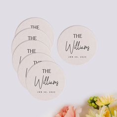 four personalized stickers with the names of five different people on them and flowers