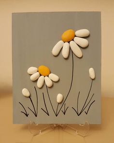 there is a card with some flowers on the front and back of it that has been made to look like something out of clay