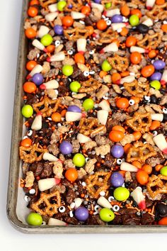 a tray filled with lots of different types of food on top of a white table