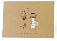 a card with a drawing of two people holding hands and the words mr & mrs macrae written on it