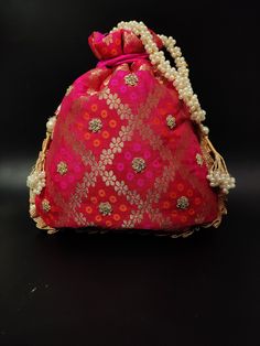 "traditional indian wedding delicate gota patti embroider gifting potli bag giveaways | rani pink drawstring purse with beaded chain Package Contents: 1 Size: 10\" x 8\" Designed with the heart, this beautiful Potli or batawa bag are eye catchy and made of premium material. Key Features: Embroidery art work. This potli is good match with both Indian and western outfits and are superb for wedding and festive parties. This would be best complement to your designer saree, lenhga or any other kind o Red Zari Work Potli Bag For Party, Festive Red Zari Work Potli Bag, Gold Potli Bag With Mirror Work For Gift, Festive Red Potli Bag With Handwork, Red Festive Potli Bag, Festival Bag With Mirror Work, Traditional Mirror Work Potli Bag For Festivals, Red Potli Bag With Zari Work For Diwali, Red Zari Work Potli Bag For Diwali