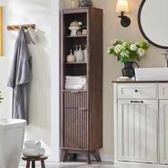 a bathroom with a wooden cabinet next to a sink