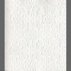 a white wallpaper with an intricate pattern on it