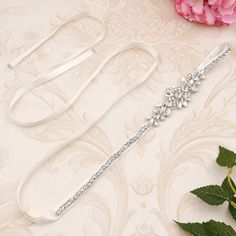 Our Bridal Crystal Rhinestone Sash adds unforgettable sparkle to your bridal look. Crafted with shimmering crystal rhinestones, it will make a stunning statement with any wedding dress. Perfect for formal events too! Belt For Dresses, Beading Dress, Fabric For Dresses, Beaded Fabric, Wedding Sash Belt, Beaded Belt, Rhinestone Dress, Dress Belt, Bridal Look