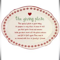 the giving plate is decorated with red and green trimmings on an oval platter