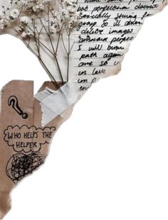 a piece of torn paper with writing on it and flowers in the middle, attached to a string