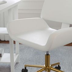 a white office chair sitting on top of a blue rug