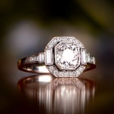 an antique diamond ring with baguets set in white gold