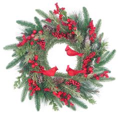 a christmas wreath with red berries and pine cones