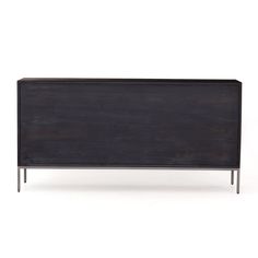 a black wooden cabinet with metal legs