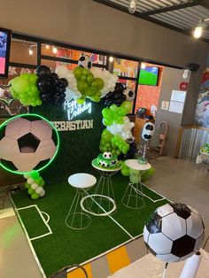 a soccer themed party with balloons and decorations