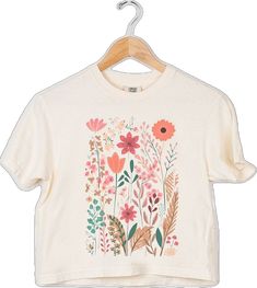 Cream Cotton Top With Floral Embroidery, Cute Cream Relaxed Fit Top, Cute Cotton Tops With Floral Print, Beige Printed Cotton Tops, Printed Beige Cotton Tops, Cream Tops With Screen Print For Spring, Spring Cream Top With Screen Print, Cream Cotton Tops With Graphic Print, Cream Short Sleeve Tops With Floral Embroidery