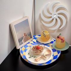 there are two plates on the table with desserts and an image in front of them