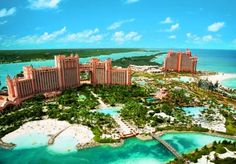 an aerial view of the resort and lagoons in the middle of the ocean, with palm trees