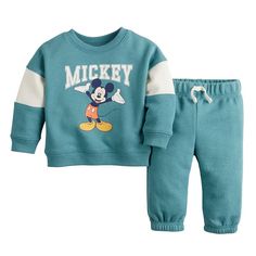 Give your little one's wardrobe a cute and cozy refresh with this babies' Mickey Mouse sweatshirt and joggers set from Jumping Beans. ©DisneyGive your little one's wardrobe a cute and cozy refresh with this babies' Mickey Mouse sweatshirt and joggers set from Jumping Beans. ©Disney Click on the BABY PRODUCTS & CLOTHES GUIDE to find everything you need to keep your baby healthy and happy!FEATURES Includes sweatshirt & pants Sweatshirt: crewneck, long sleeves, graphic on chest Pants: elastic waist Blue Cotton Family Matching Sets, Playful Blue Sets For Winter, Playful Blue Winter Sets, Blue Cartoon Print Long Sleeve Sets, Blue Long Sleeve Sets With Cartoon Print, Blue Long Sleeve Cartoon Print Sets, Blue Letter Print Sets For Playtime, Blue Playtime Sets For Fall, Playful Blue Sets With Letter Print