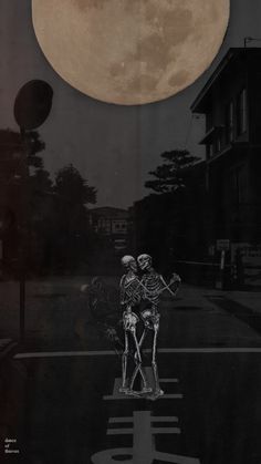 two skeletons standing in the middle of a street under a full moon