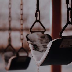 the swings are covered with snow and water