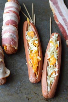 bacon wrapped hot dogs with cheese and other toppings