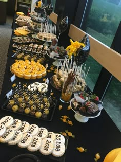 a buffet table filled with desserts and pastries