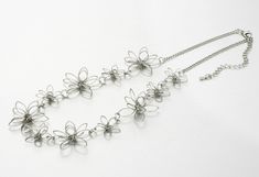 Love the soft silver finish.. It looks great. Felicia Flower Necklace - Pearl + Creek Elegant Silver Flower Necklace With Decoration, Elegant Silver Flower Decoration Necklace, Elegant Metal Flower Necklace For Wedding, Silver Flower Necklace For Wedding, Delicate Adjustable Silver Flower Necklace, Whimsical Silver Flower-shaped Jewelry, Whimsical Silver Flower Jewelry, Adjustable Silver Flower Necklace For Party, Wedding Necklace With Flower Charm In Metal