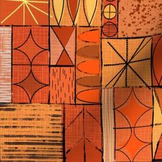 an orange and brown abstract design is featured in this image