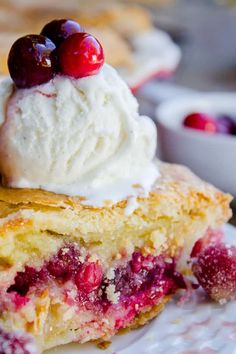 a piece of pie with ice cream and cherries on top