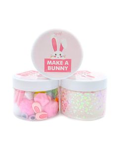 two jars filled with pink and white glitters next to each other on a white background