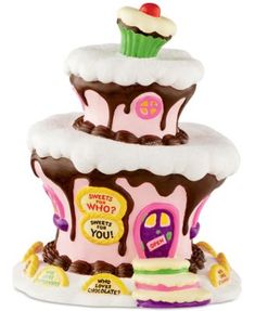 three tiered cupcake shaped cake with frosting and toppings