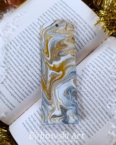 Wooden hand-painted bookmark.