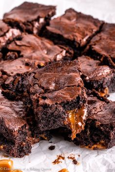 chocolate brownies with caramel drizzled on top and one cut in half