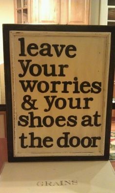 a sign that says leave your worris and your shoes at the door