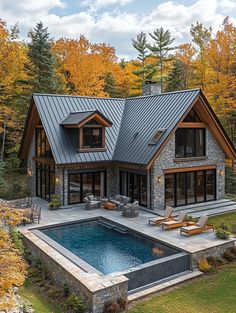 a house with a swimming pool in the front and an outdoor lounge area next to it