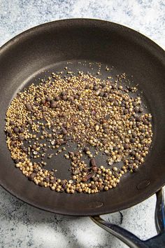 a frying pan filled with food on top of a counter