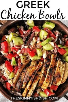 greek chicken bowls with cucumbers, tomatoes and other vegetables in a brown bowl