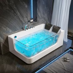 a bath tub with blue water in it