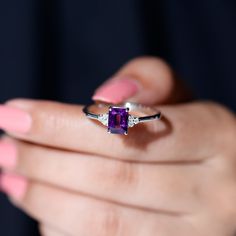 Product Details Radiate elegance with this exquisite Amethyst Ring featuring a shimmering Octagon Cut Amethyst gemstone in a delicate prong setting, beautifully accented with a trio of Diamond. Its unique design and intricate details are sure to leave a lasting impression, making it an ideal accessory for any occasion. Let this Amethyst Diamond Ring be a symbol of your love and affection, and cherish its beauty for years to come. Product Information SKU SHP-RINGS0821229273 Width 3.5 mm Height 7. Classic Octagon Amethyst Ring As Gift, Fine Jewelry Octagon Amethyst Ring With Accent Stones, Elegant Amethyst Octagon Ring, Elegant Amethyst Ring Gift, Round Cut, Octagon-shaped Amethyst Ring For Formal Occasions, Amethyst Ring Engagement, Amethyst And Diamond Ring, Engagement Jewelry, Signature Jewelry