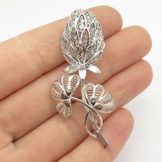 925 Sterling Silver Vintage Germany Floral Filigree Pin BroochWeight: 6.6gWELCOME TO PAWN SHOPWe are an actual pawn shop and have been in business for over 25 years.Since 1990, our establishment has been serving a variety of clients by providing them with short term cash solutions and options of liquidity regarding their treasured heirlooms.Acknowledging that today′s customers are very sophisticated and are looking for a variety of investments, our acquisitions are hand-picked for our special cl Ornate Silver Engraved Brooches, Ornate Silver Brooch With Intricate Design, Silver Filigree Sterling Silver Brooch, Silver Filigree Brooch In Sterling Silver, Ornate Silver Brooches With Intricate Design, Silver Sterling Silver Filigree Brooch, Ornate Silver Filigree Brooches, Elegant Silver Brooches Stamped 925, Silver Filigree Brooch For Formal Occasions