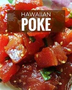 hawaiian poke cake on a white plate with sesame seeds and garnished in red sauce