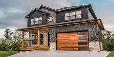 a large house with two garages on each side