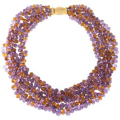 Elegant and finely detailed Buccellati torsade necklace, finished with a 18 karat yellow gold clasp. Three strands of briolette faceted citrine and amethyst measure (average) 5mm. The semi-precious gemstones are in excellent condition and free of cracks or chips. The necklace measures 17 inches in length and sits nicely at the nape of the necklace. The briolette cut allows maximum sparkle from the citrines and amethysts. The necklace makes a wonderful statement on its own with a great pop of col Buccellati Jewelry, Multi Gemstone Necklace, Thick Necklace, Contemporary Necklace, Necklace Amethyst, Moms Bracelet, Citrine Earrings, Heart Necklace Diamond, White Gold Necklaces