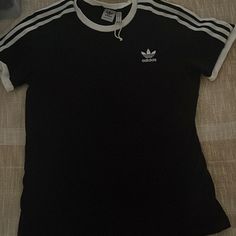 Black With White Stripes On Sleeve, Short Sleeve Black Three Stripes Crew Neck T-shirt, Black Crew Neck T-shirt With Three Stripes, Casual Black T-shirt With Three Stripes, Adidas Black Tops With Three Stripes, Black Cotton Top With Three Stripes, Black Cotton Tops With Three Stripes, Black T-shirt With Three Stripes, Black Tops With Three Stripes For Spring, Adidas Tshirt