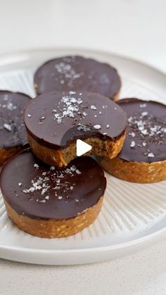 chocolate covered pastries on a white plate